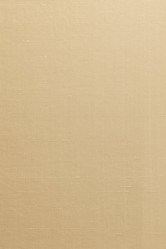 Gold background of ilk cotton linen blended fabric textile textured in light yellow color
