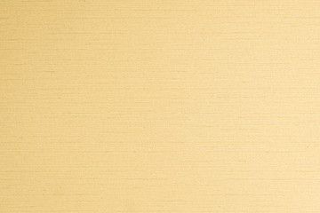 Cotton silk blended fabric wall paper texture pattern background in pastel yellow gold brown color