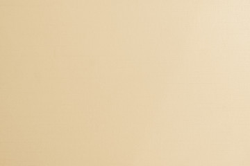 Cotton fabric woven textile textured background in yellow gold cream beige color .