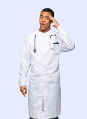 Young afro american man doctor has just realized something and has intending the solution on isolated background