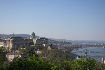 Skyline view of Buda Castle Royal Palace with Szechenyi Chain Bridge leading across the danube river.