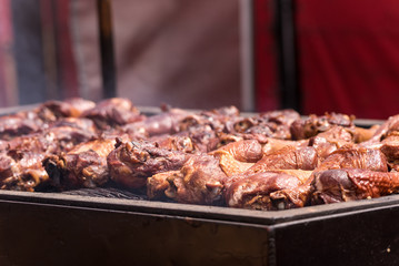 Barbecue meat is smoking hot on the outdoor grill so potential customers might want to eat the BBQ chicken.