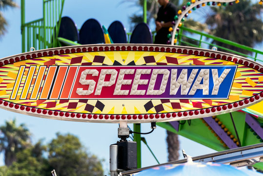 Large sign clearly advertises to potential customers where to find speedway to satisfy the adrenaline rush.