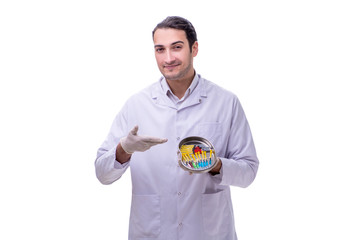 Young handsome doctor with syringe isolated on white