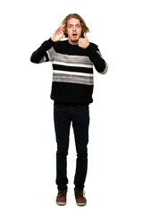 Full-length shot of Blonde man showing ok sign and thumb up gesture over isolated white background