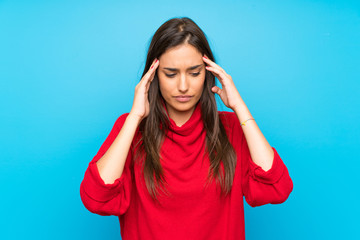 Young woman with red sweater over isolated blue background unhappy and frustrated with something....