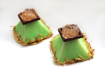 Lime pyramid dessert with aloe vera jelly and flower petals