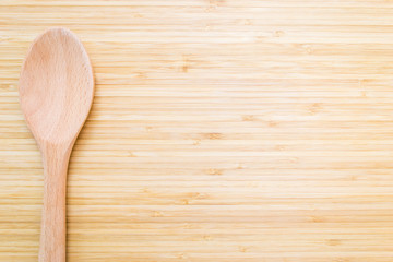 Isolated wooden board with wooden spoon
