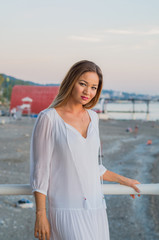 A cute asian girl on a white seaside