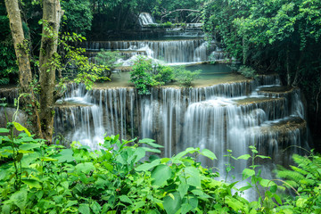 A beautiful waterfall among the forest in Thailand. It is the best place for camping to feel fresh air, green leaves and peaceful nature during holiday. 