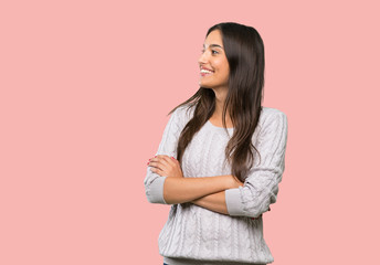 Young hispanic brunette woman happy and smiling over isolated background