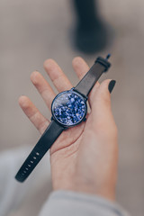 Stylish watch in woman hand