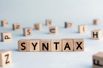 syntax - word from wooden blocks with letters, grammatical arrangement concept, random letters...