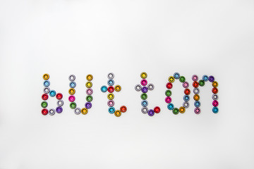 word button made of multicolored round buttons on white background