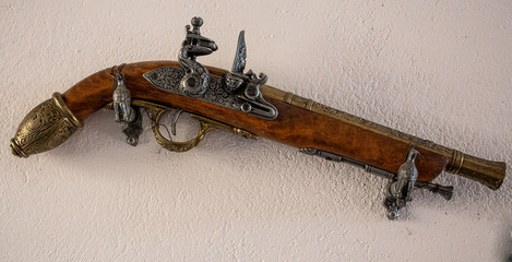 antique gun on the wall
