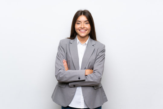 Young business woman over isolated white background keeping the arms crossed in frontal position