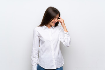 Young woman over isolated white background laughing