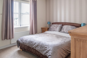 Modern Bedroom in Scottish Housing Developement Decorated in Soft modern Colours