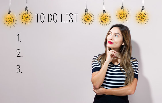 To do list with young businesswoman in a thoughtful face
