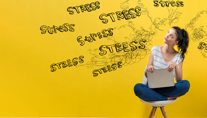 Stress theme with young woman using a laptop computer