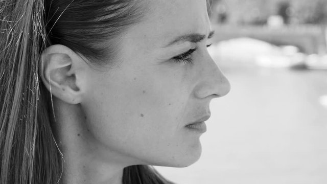 Young woman smokes a cigarette - close up shot