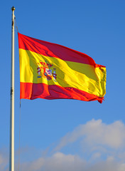 Fototapeta na wymiar View of the yellow and red Flag of Spain (Bandera de España) floating in the wind