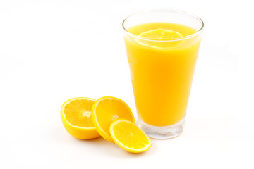 Fresh orange juice in the glass on white background