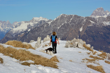 hikers in the mountains with dog 
