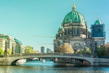 Beautiful overview of the old Friedrichs Brigde above the Spree river and next to the Berliner Dom, the Cathedral of Berlin under reform, in Mitte
