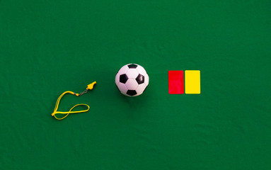 soccer ball, whistle and referee cards