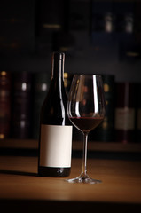 bottle and glass of red wine