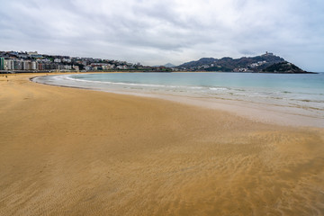 La Concha beach a low tide winter day, San Sebastian, Basque Country, Spain