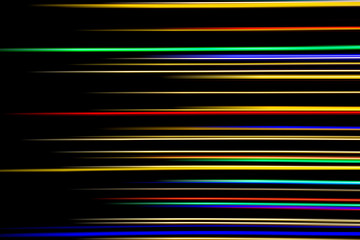 Horizontal multicolor light rays on a black background.