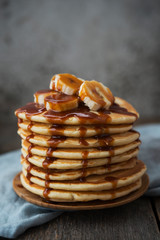 American  pancakes with banana and  caramel. Vertical orientation
