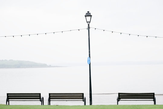 Seaside Seats Benches Empty Due To Wet British Summer During Rain