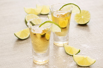 Tequila shots with sliced lime
