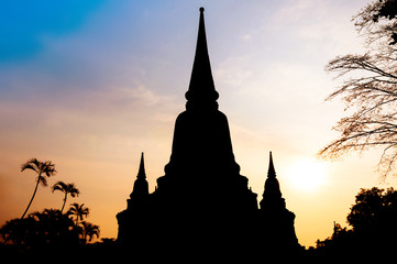 Silhouette of Wat Yai Chai Mong Khol Temple of Ayuthaya Province sunset ( Ayutthaya Historical Park ) at Thailand