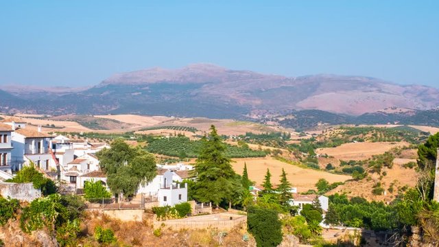 Ronda, Spain. Aerial view of houses in Ronda, Andalusia, Spain. Time-lapse of a popular landmark with mountains at the background, panning video