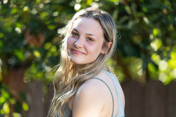 Fototapeta premium Portrait of pretty young girl outside