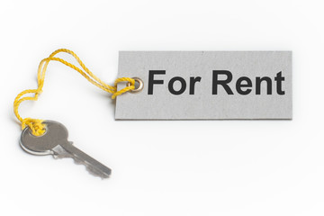 Keys with a keychain in the shape of a house. For rent - tag on a keychain