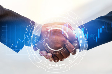 Partnership - business man handshake with effect digital network link connection and graph chart of...
