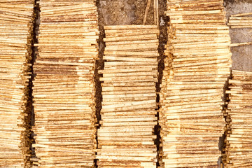 Sawmill logs stacked aerial view and wood saw machinery