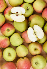 Drops of water on ripe apples. Two halves of a ripe apple.