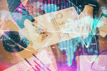 International business hologram over hands taking notes background. Concept of success. Multi exposure