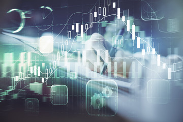 Financial forex graph displayed on hands taking notes background. Concept of research. Multi exposure