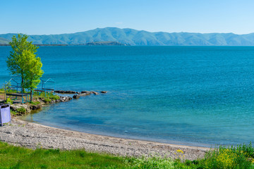 Beautiful famous lake Sevan in Armenia, mountain view on the opposite shore