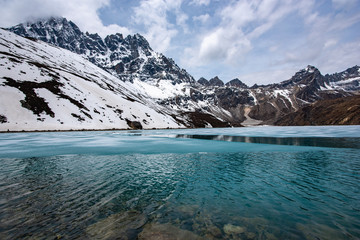 Fototapeta na wymiar Ice on Gokyo Lake in Nepal Himalayas