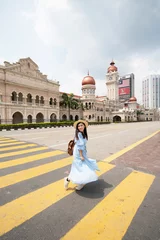 Fotobehang Tourist is sightseeing at The Sultan Abdul Samad building is located in front of the Merdeka Square in Jalan Raja,Kuala Lumpur Malaysia. © BUSARA