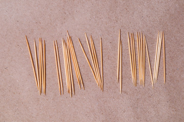 Toothpick on brown paper background