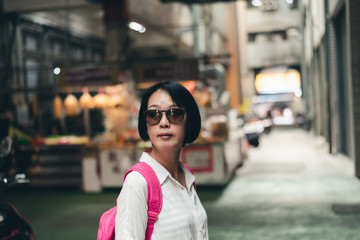 Asian woman walk in the traditional marketplace